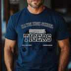 A man wearing a navy blue t-shirt with a 'Haysi High School Tigers' graphic on the front, featuring a school bus, tiger head, and paw prints.