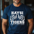 A man wearing a navy blue t-shirt with a white graphic print that reads 'HAYSI TIGERS ALWAYS A TIGER AT HEART' with tiger head illustrations.